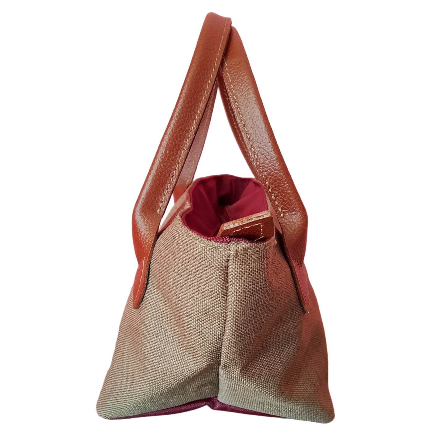 Bolso de loneta verde y asas marrón , visto de ado