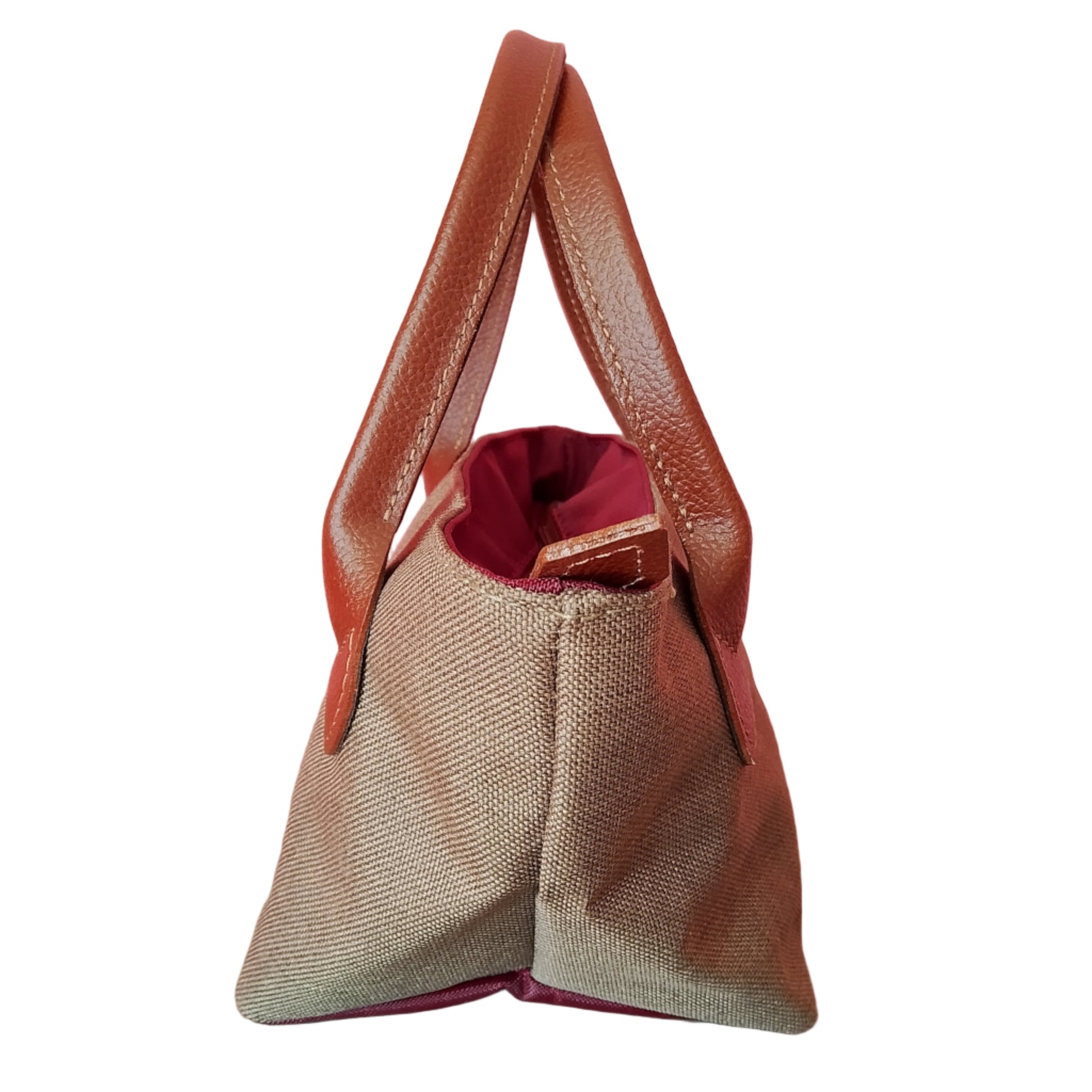 Bolso de loneta verde y asas marrón , visto de ado