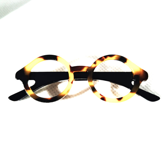 Broche gafas pasta  redondas con tonos marrones y beiges y patillas negras 